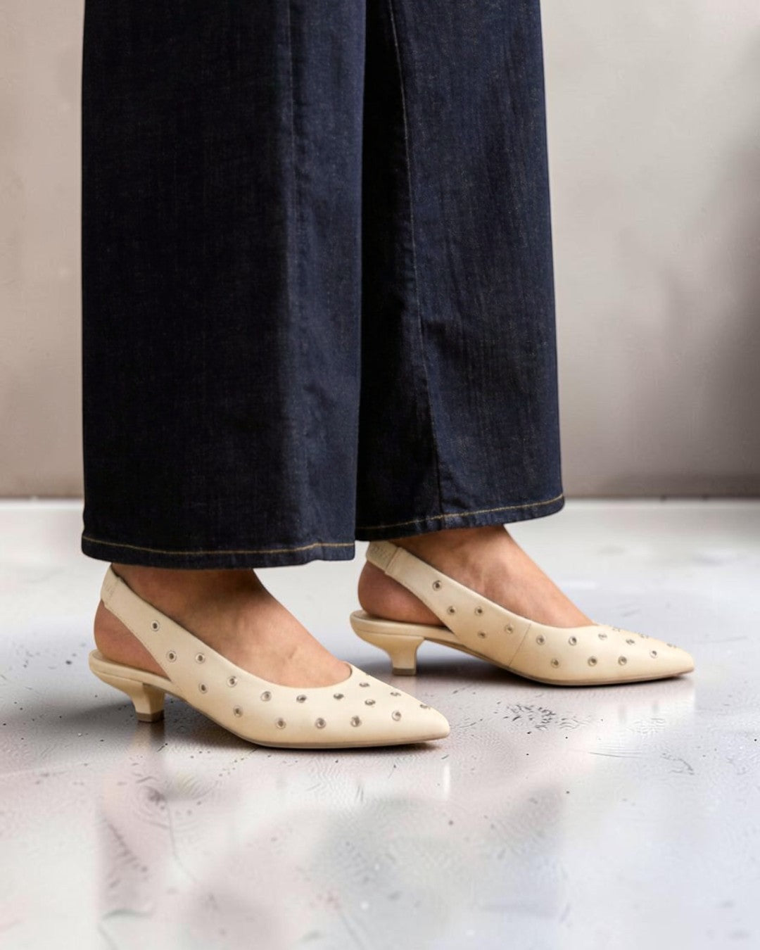 LUMINOUS ELEGANCE & GERMAN CRAFTSMANSHIP: STUDDED SLINGBACK PUMPS (WHITE)