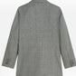 Scotch & Sodaのチェック柄オーバーサイズブレザーの平置き背面。襟から裾までのチェック柄と袖口のボタンが見える