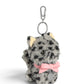 WOUF Colette Cat Charm 斜め前から見た猫バッグチャーム、ピンクリボンとシルバー色のロゴメダル、立体的な座り姿