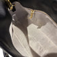 SILKEN TOUCH & TIMELESS KNOT: NAPPA LEATHER DRAWSTRING CLUTCH BAG