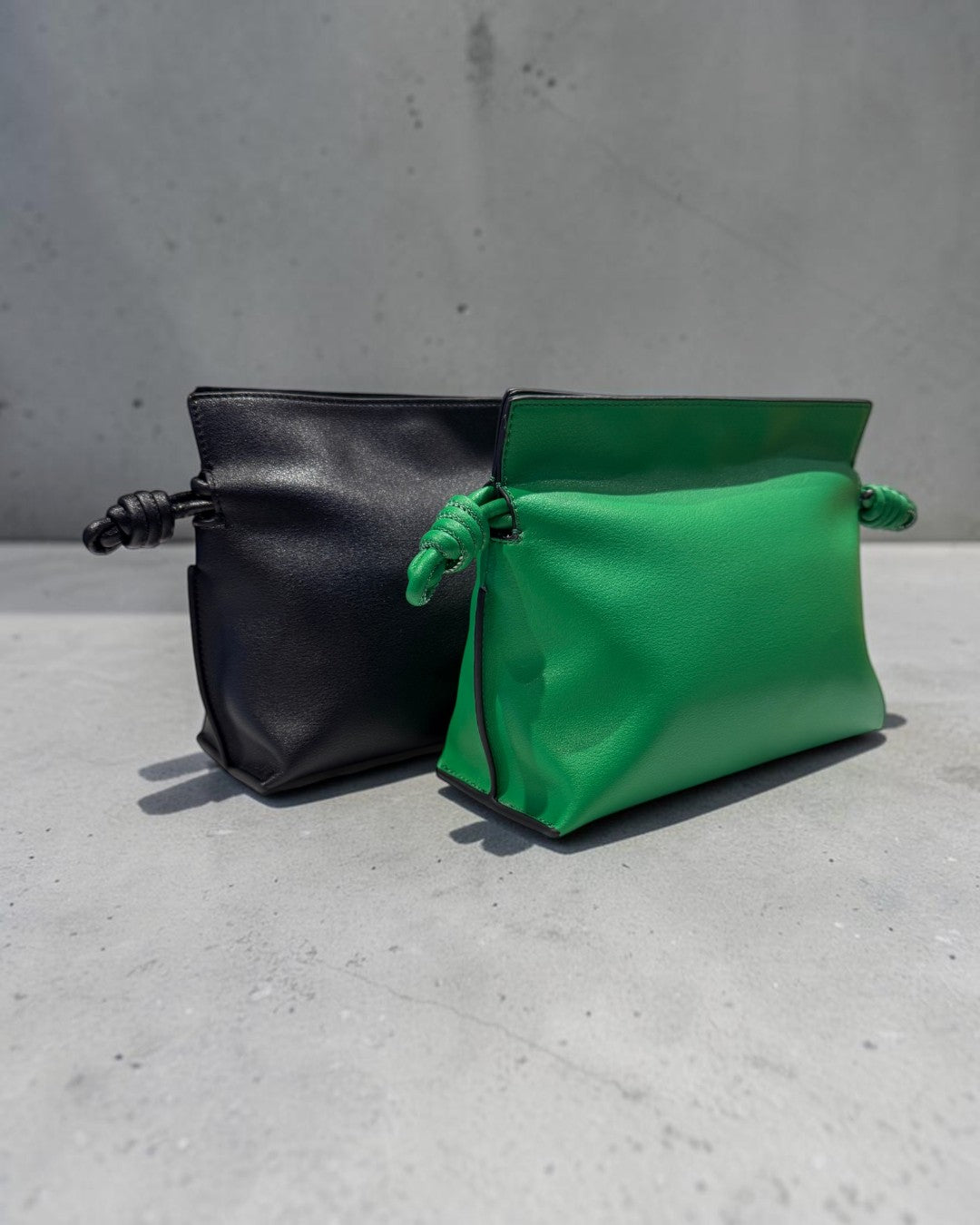 SILKEN TOUCH & TIMELESS KNOT: NAPPA LEATHER DRAWSTRING CLUTCH BAG