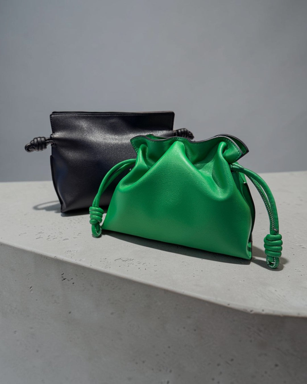 SILKEN TOUCH & TIMELESS KNOT: NAPPA LEATHER DRAWSTRING CLUTCH BAG