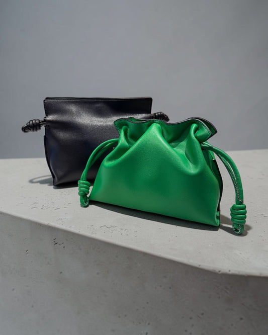 SILKEN TOUCH & TIMELESS KNOT: NAPPA LEATHER DRAWSTRING CLUTCH BAG